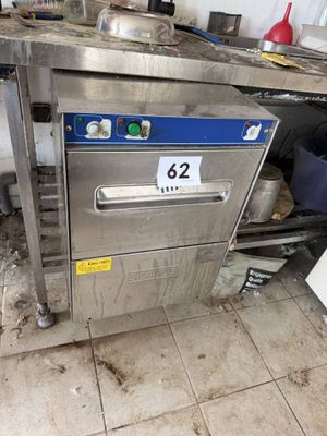 an image of a commercial kitchen with a lot of clutter