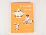 an orange book with a picture of a teapot and a bowl on it