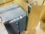 many boxes of computer equipment in a room
