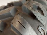 a close up of a motorcycle tire on a white surface
