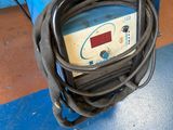 a blue machine that is sitting on a blue floor
