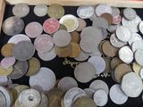 a box full of coins that are sitting on a table