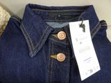a close up of a pair of jeans with a tag on it