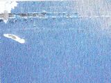 a blurry image of a person on a surfboard in the water