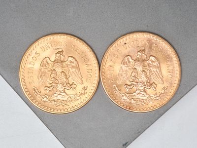 two gold coins sitting on top of each other