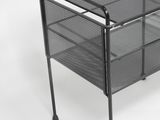 a black metal table with a glass top on a white background
