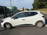 a white car that is parked on the side of the road