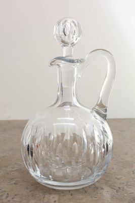 a clear glass decanter on a wooden table
