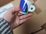 a person that is opening a box with a pair of scissors