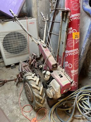 a pile of old tools and other junk on the ground