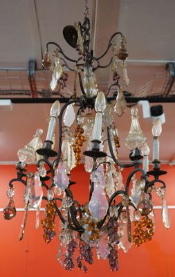 a chandelier hanging from the ceiling in a room