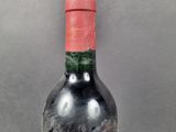 a bottle of wine that is sitting on a table