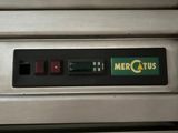 a close up of a metal oven with a sign on it