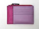 purple and pink leather wallet with zipper on white background