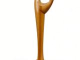 a wooden sculpture of a hand holding a piece of wood