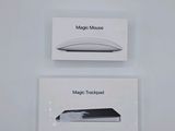 two boxes of apple magic mouses sitting on top of each other