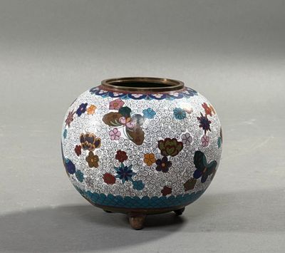a vase with a flower design on it on a table