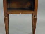 a small wooden table with a shelf on top of it