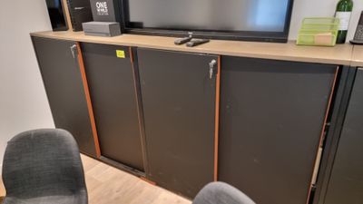 a flat screen tv sitting on top of a entertainment center