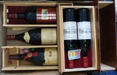 many bottles of wine in a wooden box on a table