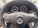 steering wheel of a mercedes car with various gauges and gauges