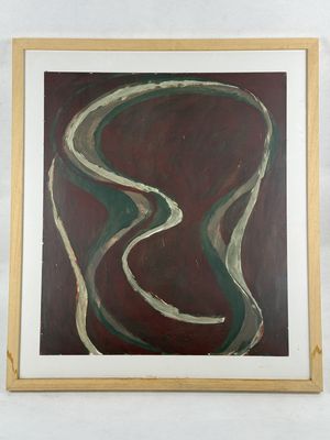 abstract painting in a wooden frame on a white wall