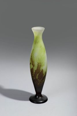 an image of a green and black vase sitting on top of a table