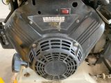 a close up of a small engine on a stand