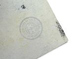 a book with a stamp on it sitting on a table