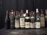 many bottles of wine lined up on a table