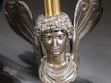 a statue of a woman holding a torch in her hand