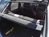 the back of a car with a gun in the trunk of it
