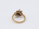a close up of a gold ring on a white surface