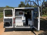 a white van that is parked on the side of the road