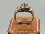 a close up of a ring with a stone on top of it