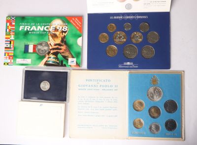 a lot of coins and a book on a table