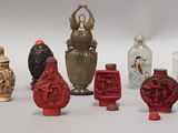 a lot of different vases that are sitting on a table