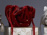 three teddy bears that are sitting in a box