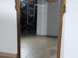 a mirror that is sitting on the floor in a room