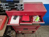 a red tool chest with a lot of tools in it