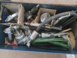 a box full of hoses and other tools in it