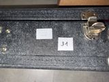 a black suitcase with a label on it sitting on a table