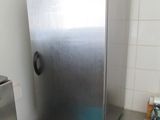 a stainless steel refrigerator sitting in a kitchen next to a dishwasher