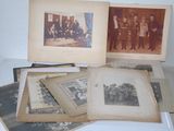 several old photographs of men and women are sitting on a table