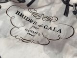 a white bag with a black and white label on it