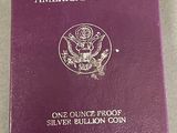 an american eagle one ounce silver bullion coin in a purple box