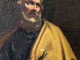 a painting of a man in a yellow cloak holding a flower