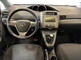 the interior of a car with a steering wheel and dashboard controls