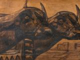 un tableau représentant deux taureaux debout l'un à côté de l'autre