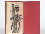 un livre sur lequel figure le dessin d'un squelette